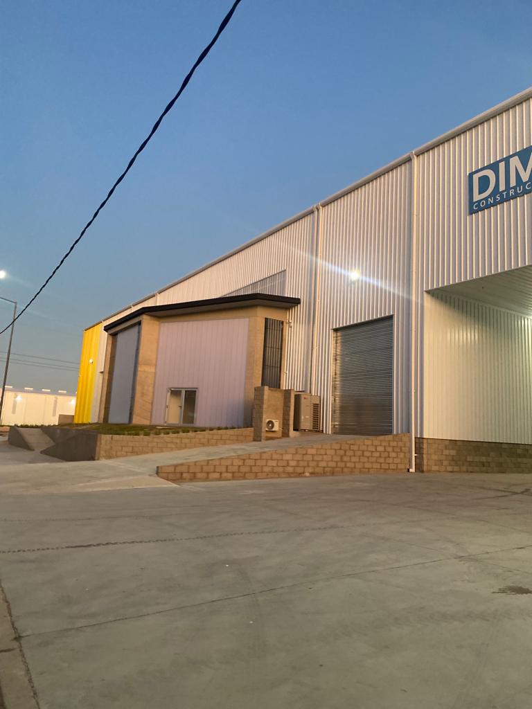 Warehouse expansion insulated panel roof